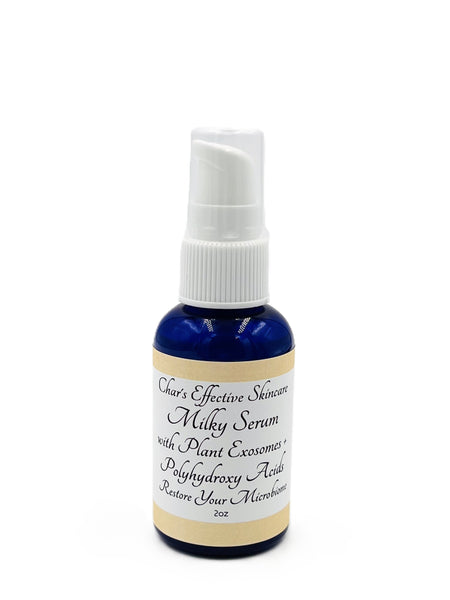 Milky Serum with Plant Exosomes and Polyhydroxy Acids/Dark Blue 2oz bottle with White Treatment Pump/Char's Effectives Skincare