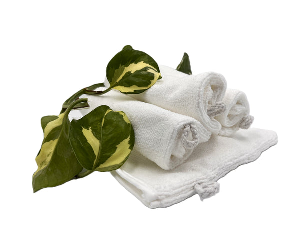 White Euro-Style Microfiber Facial Cleansing Mitts with green leaves on a white background